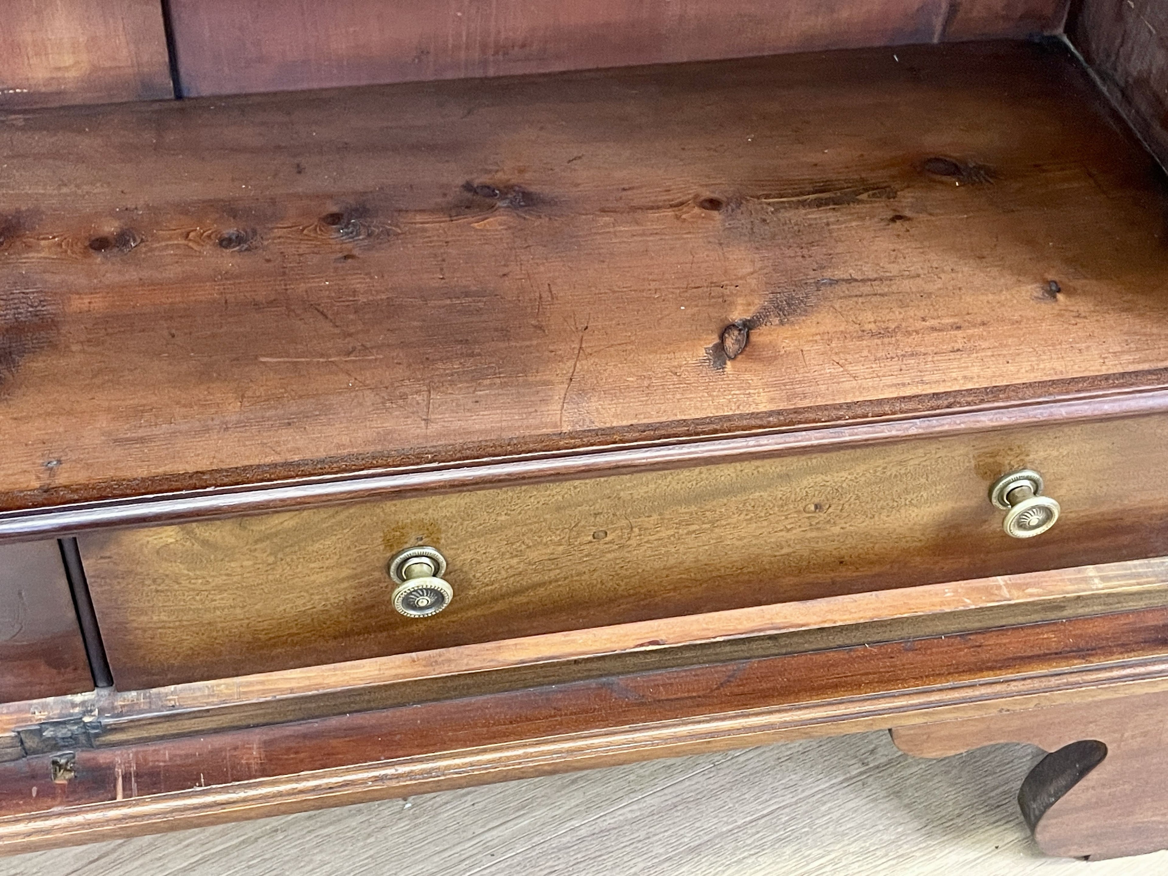 Wooden dresser with visible wear and tear