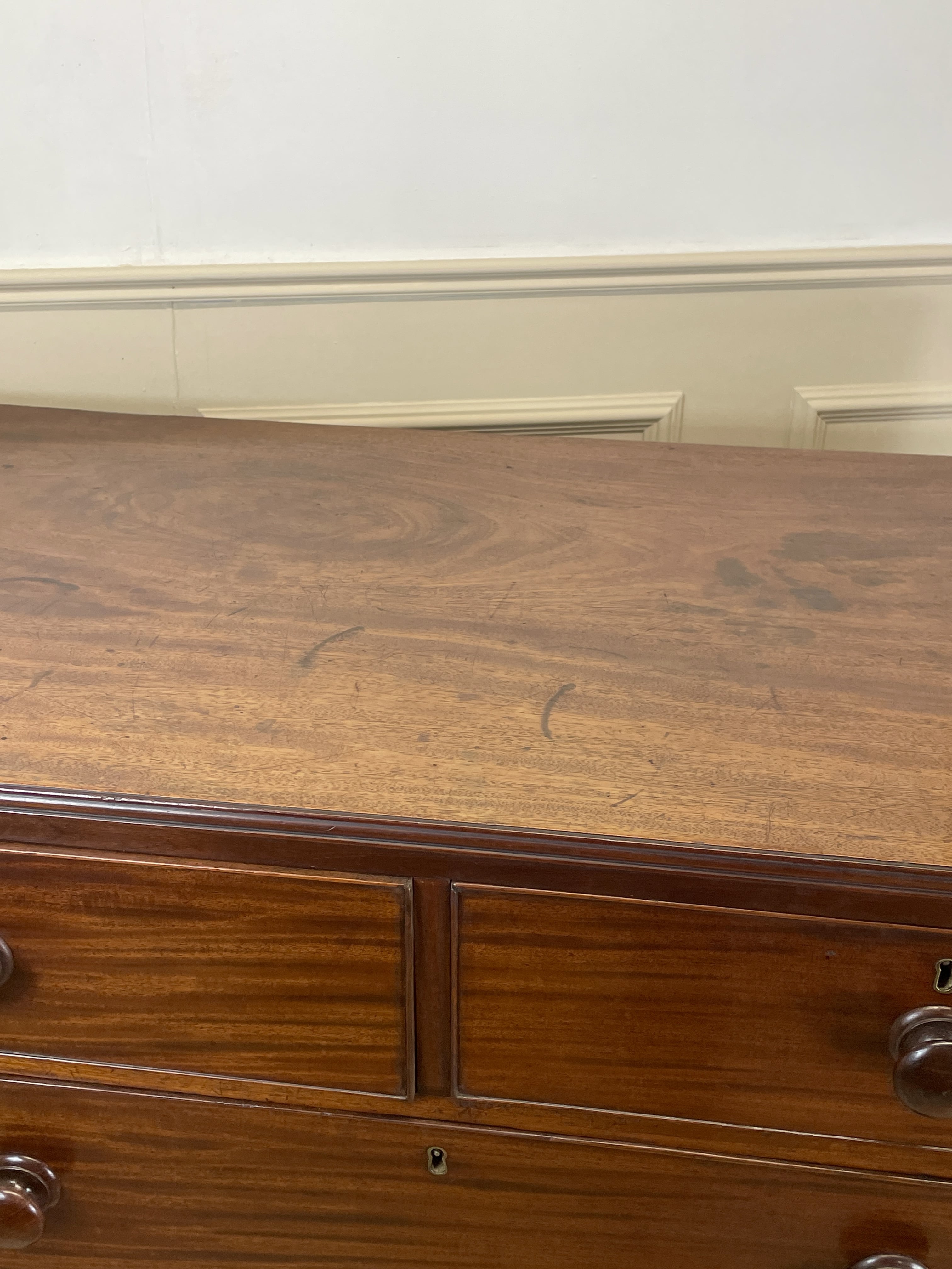 Wooden dresser with two drawers in a room setting