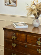 Antique light oak farmhouse chest of drawers with brass handles and patina
