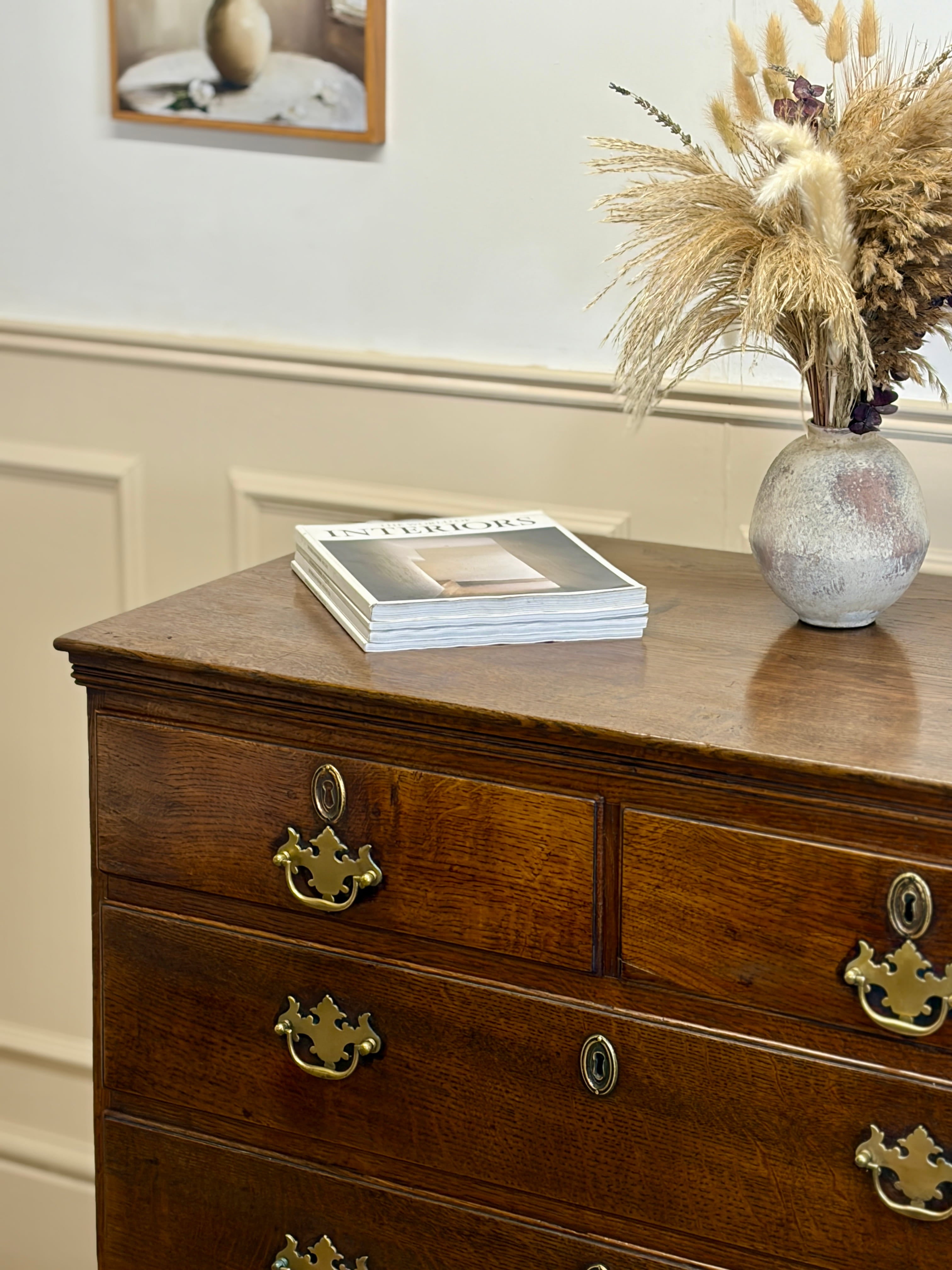 Antique light oak farmhouse chest of drawers with brass handles and patina