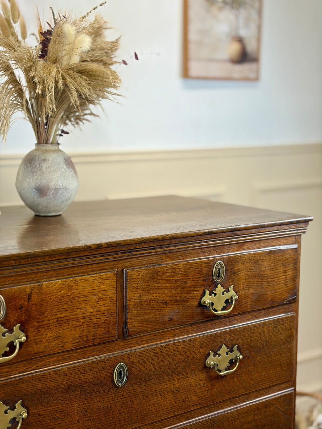 Antique light oak farmhouse chest of drawers with brass handles and patina