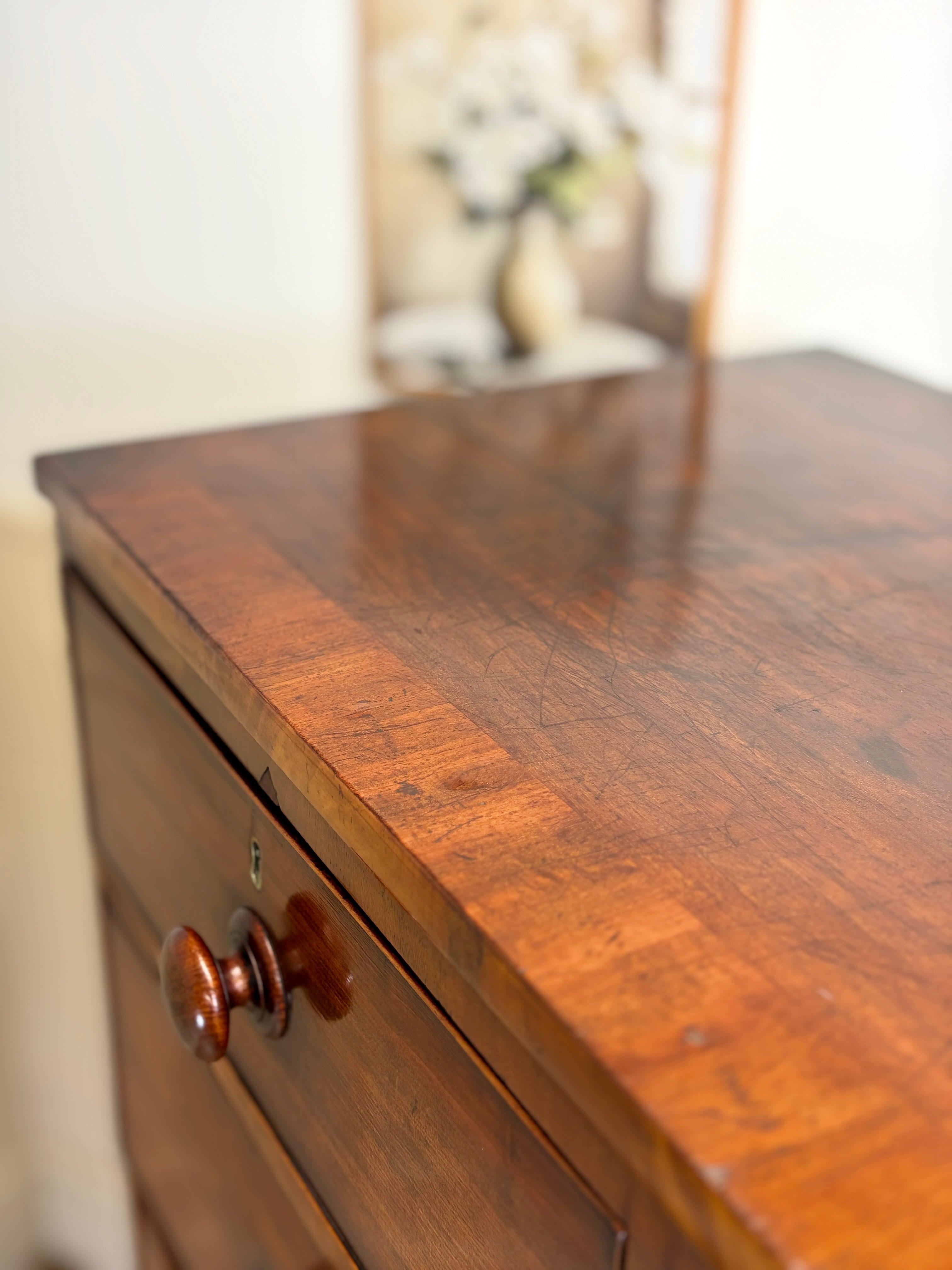 Wooden dresser with a blurred background