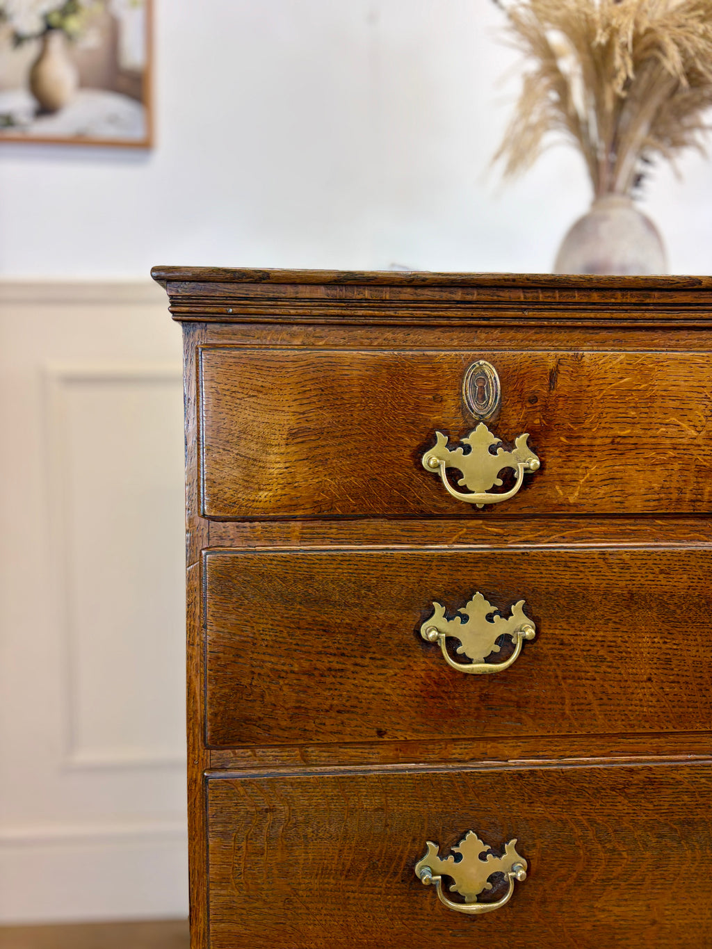Antique light oak farmhouse chest of drawers with brass handles and patina