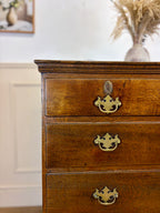 Antique light oak farmhouse chest of drawers with brass handles and patina