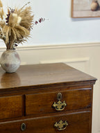 Antique light oak farmhouse chest of drawers with brass handles and patina