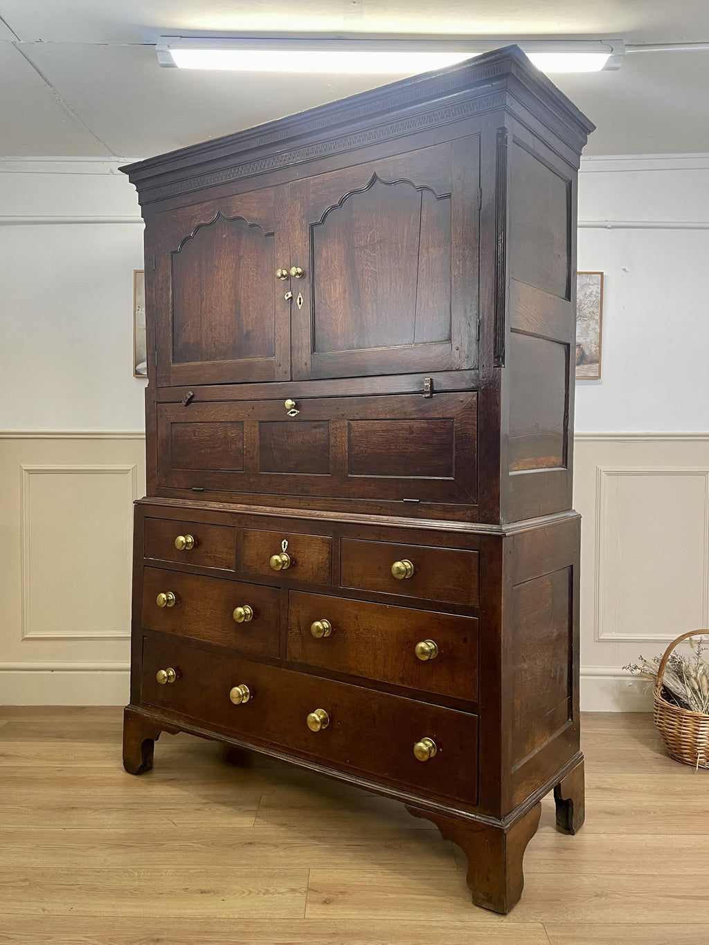 Wooden cabinet with drawers and doors in a room setting