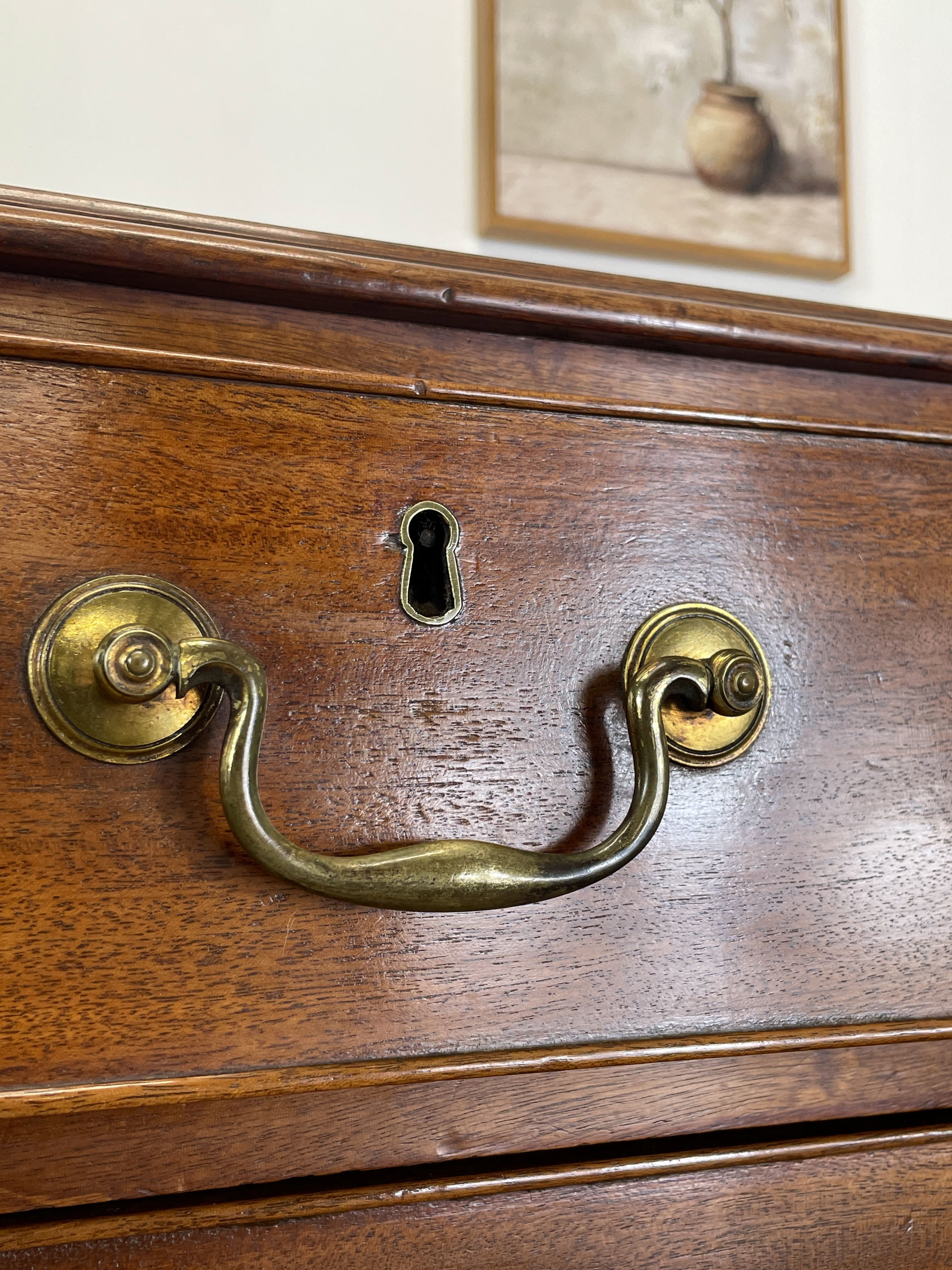 Antique Early Georgian mahogany straight front chest of drawers with original brass handles and flame mahogany finish, professionally restored by Taylors Antiques & Interiors.