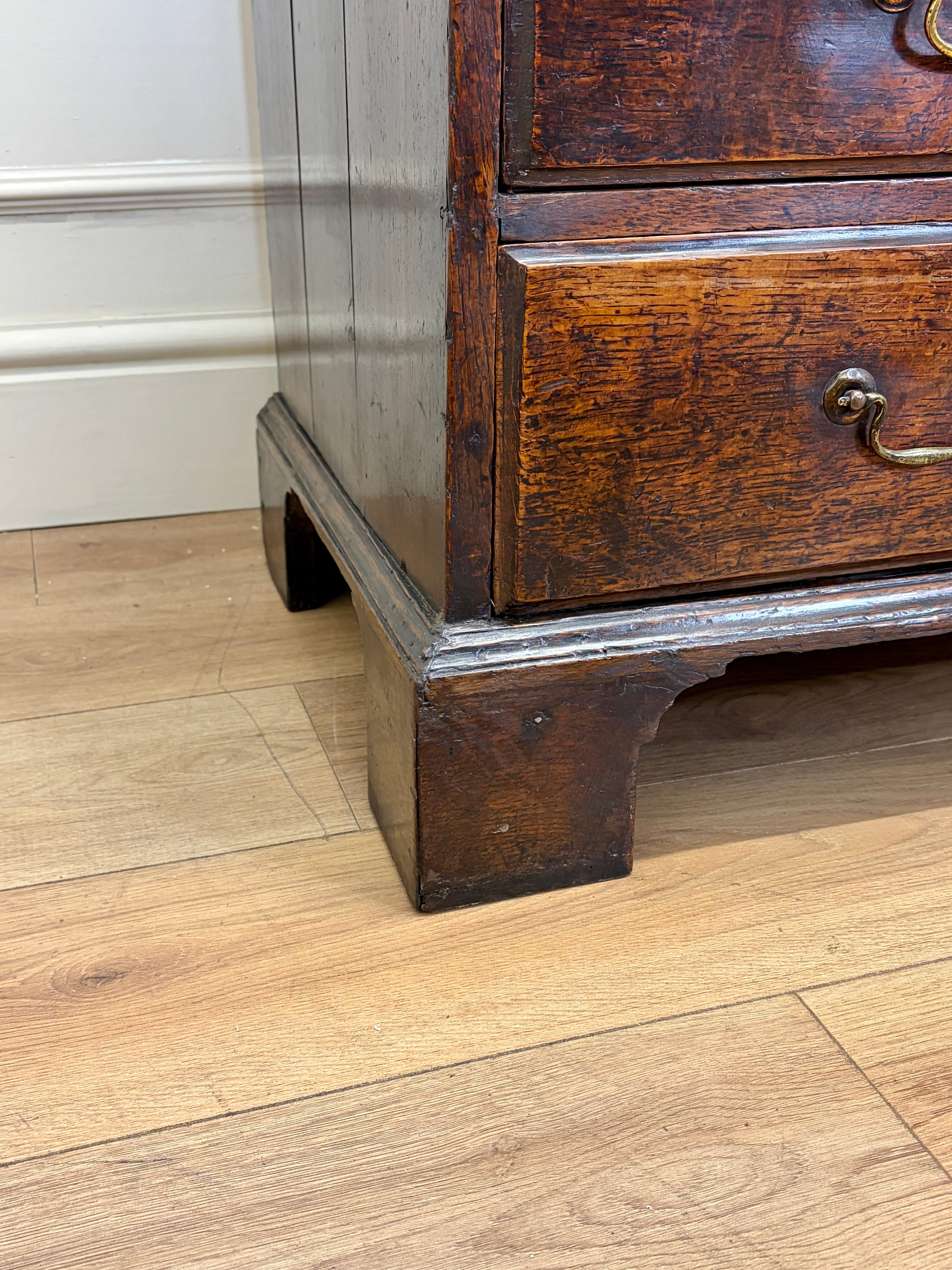 Wooden furniture with a drawer on a wooden floor
