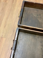 Wooden drawer with a metal handle on a wooden floor