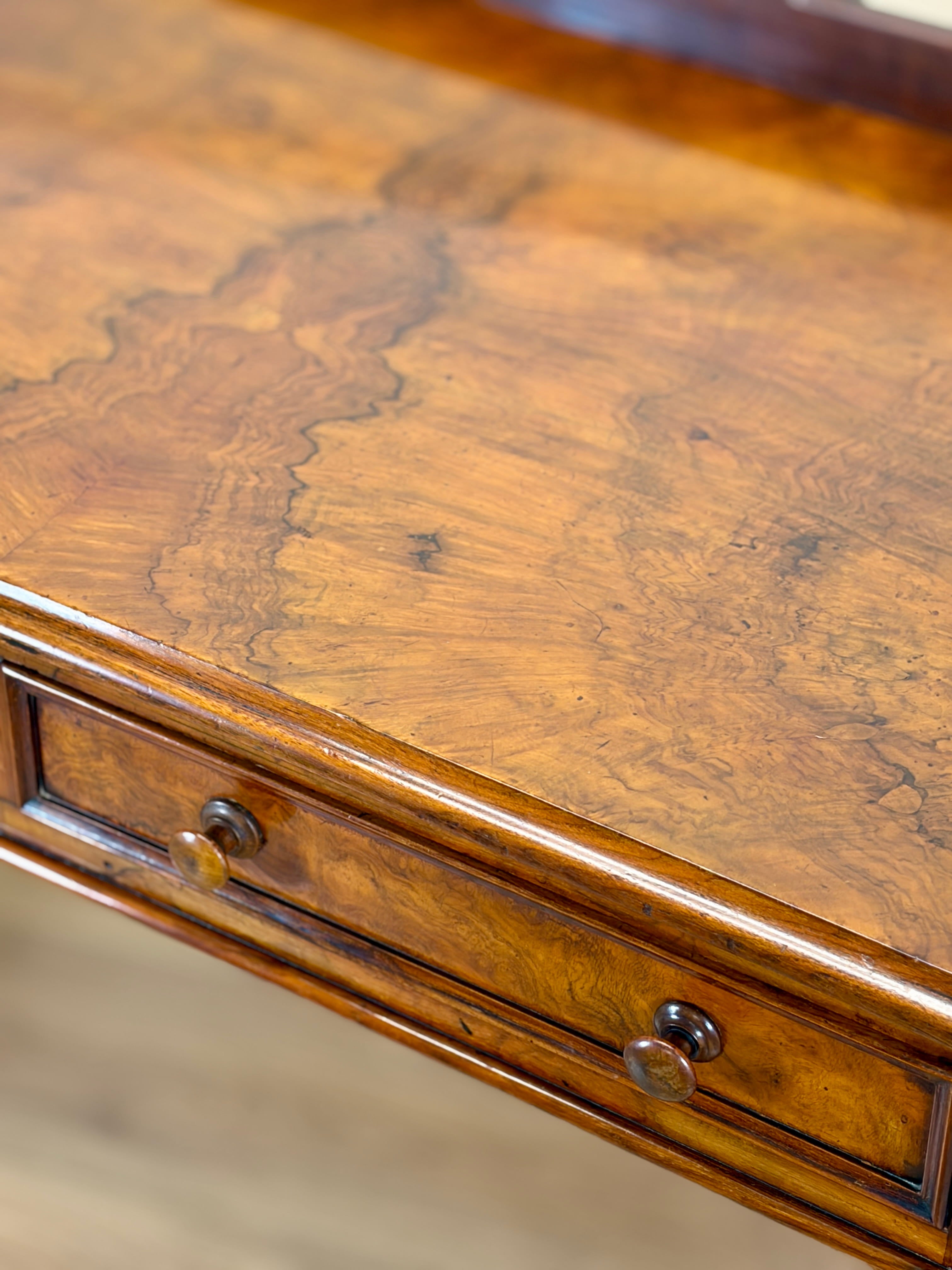 Close-up of a wooden desk with a drawer