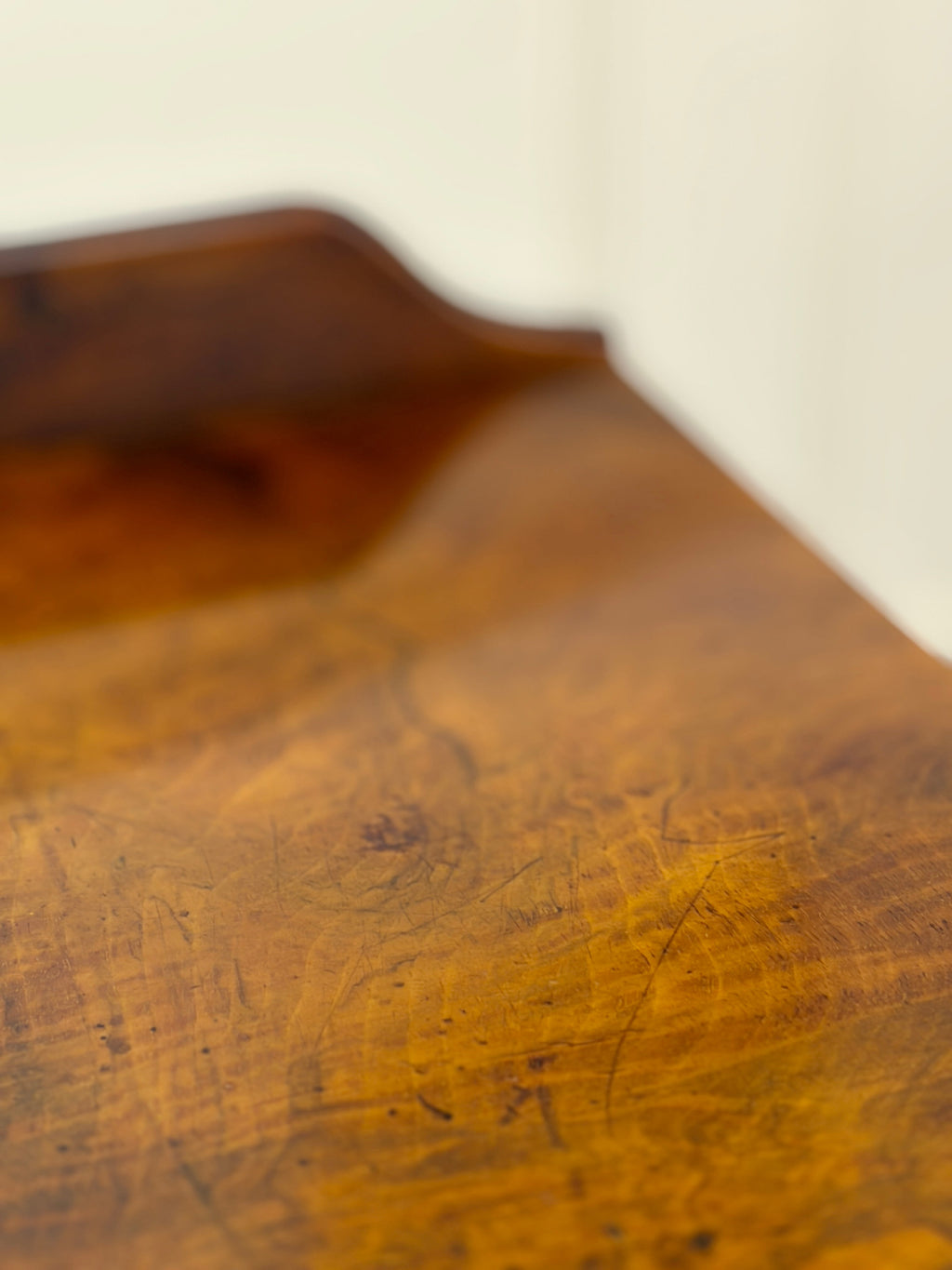 Close-up of a wooden surface with visible grain and texture.