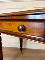 Wooden drawer with a knob on a wooden floor.