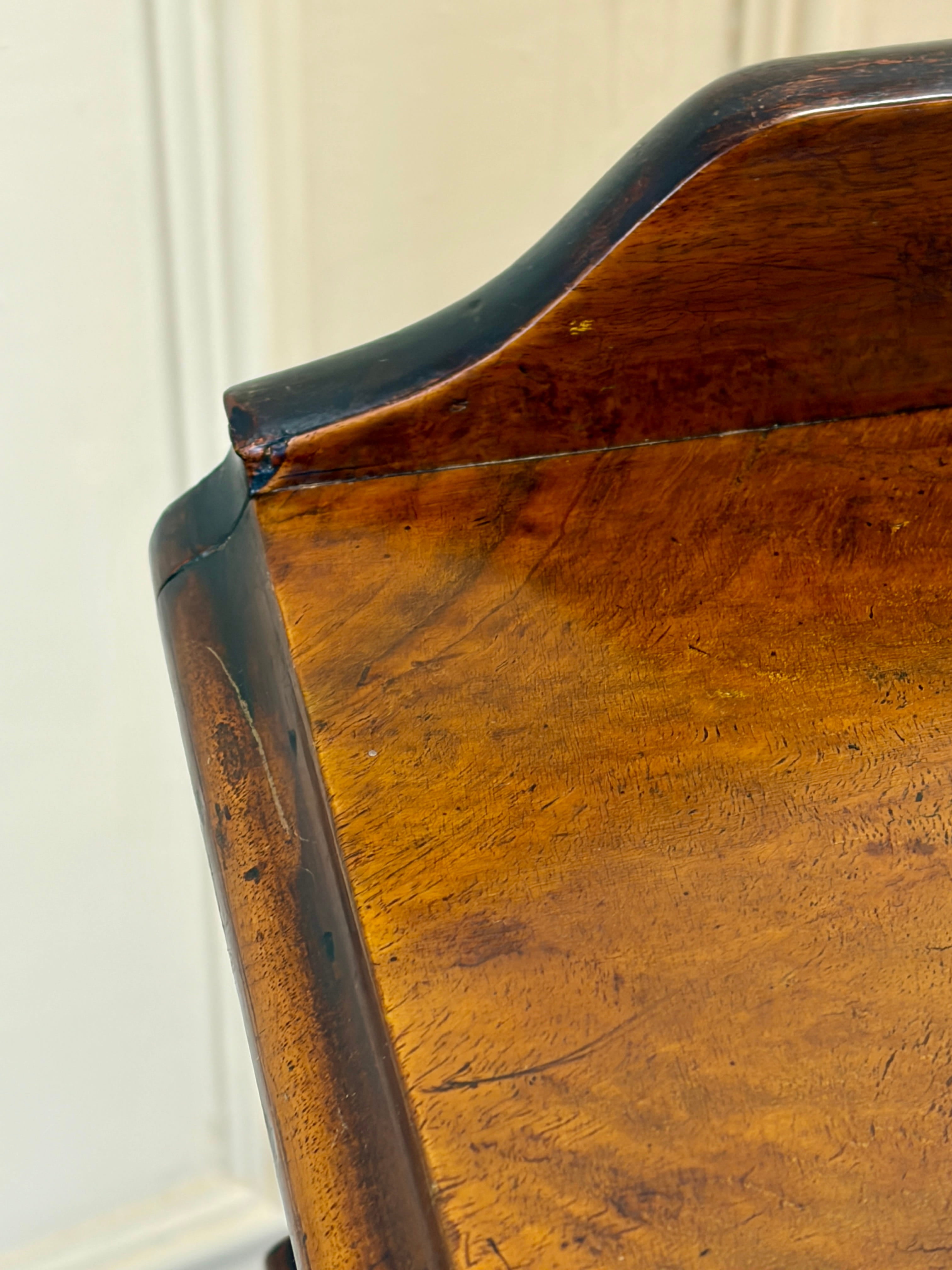Close-up of a wooden surface with a white wall background