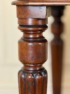 Close-up of a wooden pedestal with a blurred background