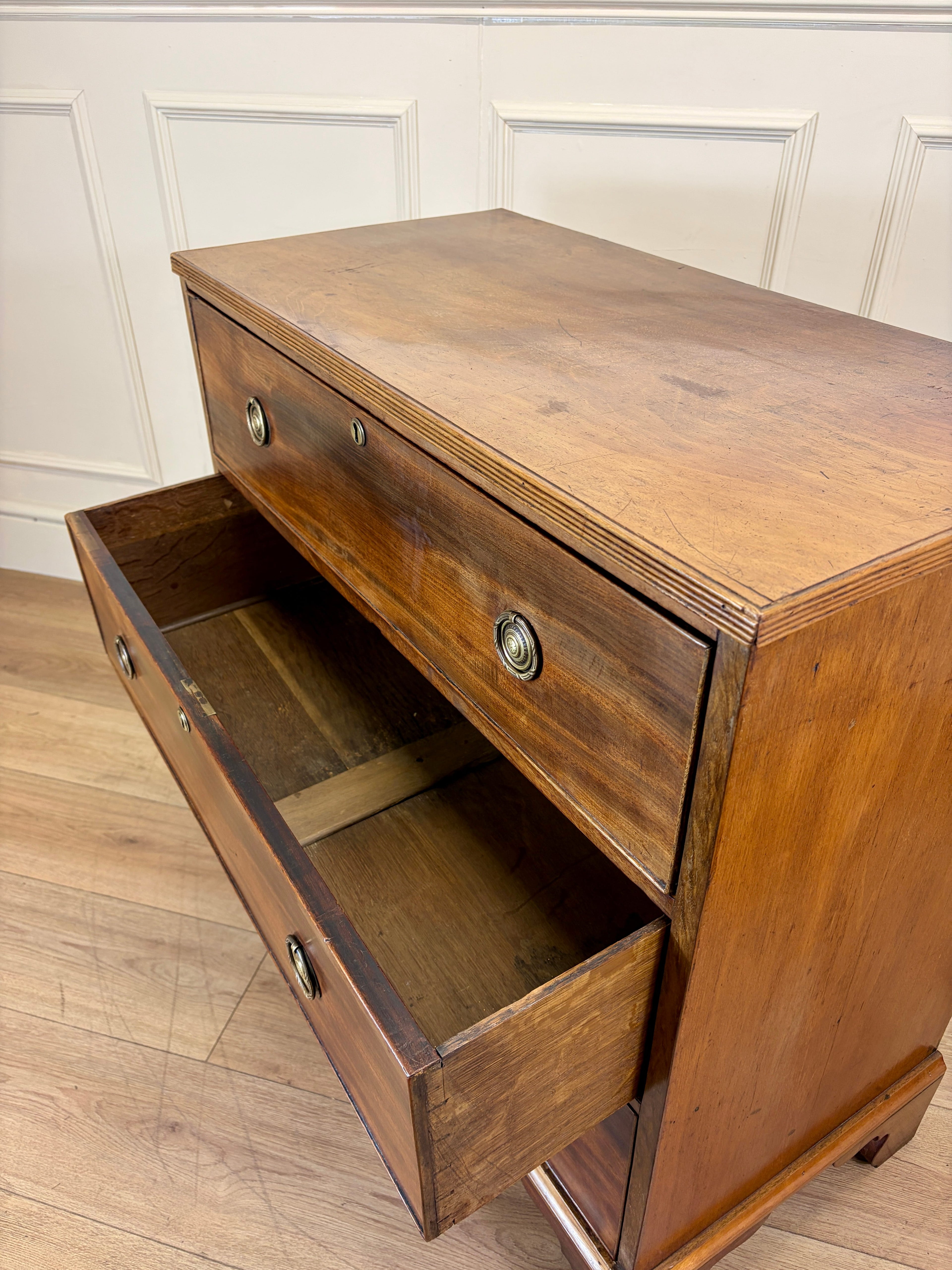Antique small Georgian mahogany chest of drawers with three drawers and brass fittings