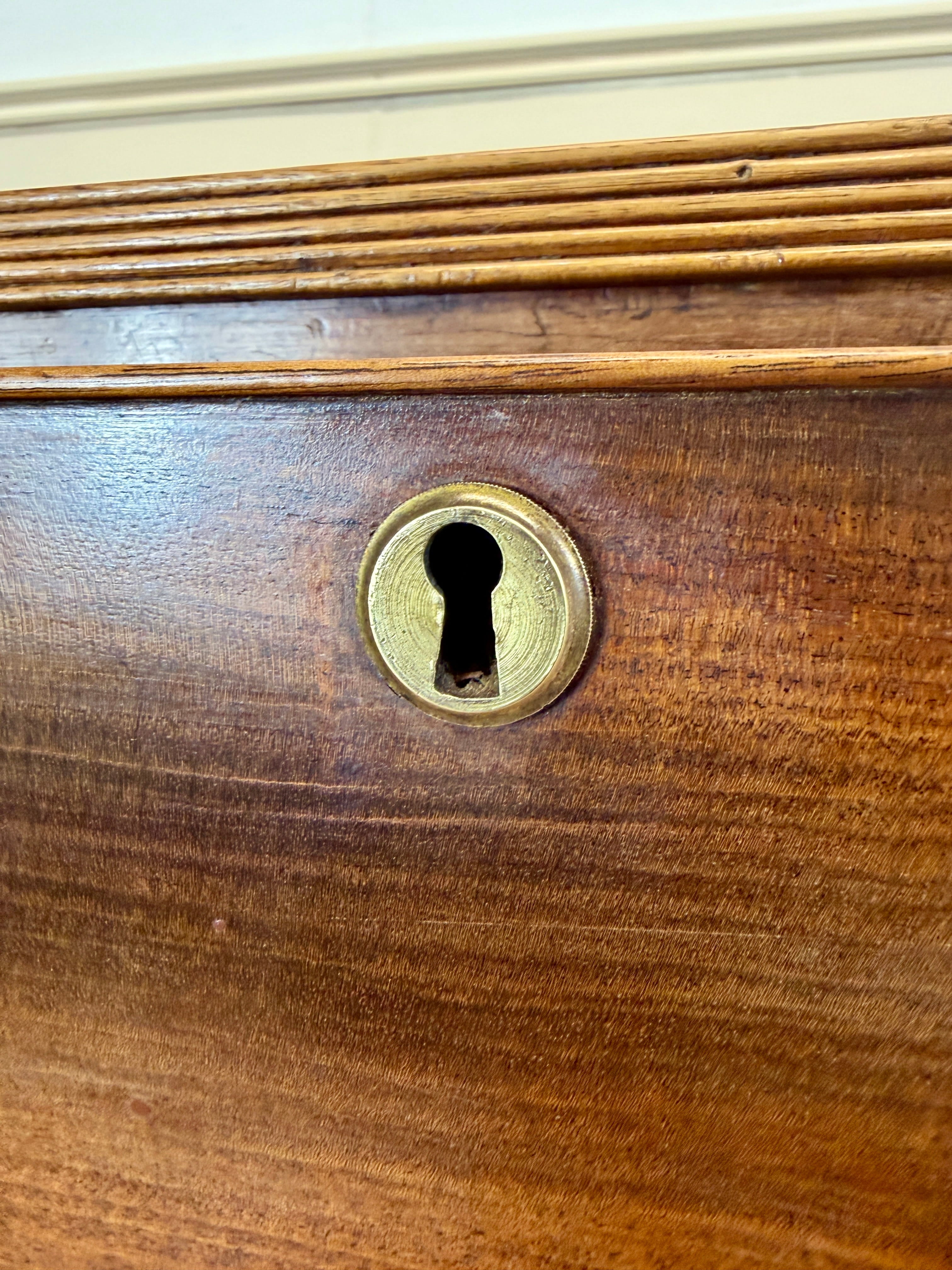 Antique small Georgian mahogany chest of drawers with three drawers and brass fittings