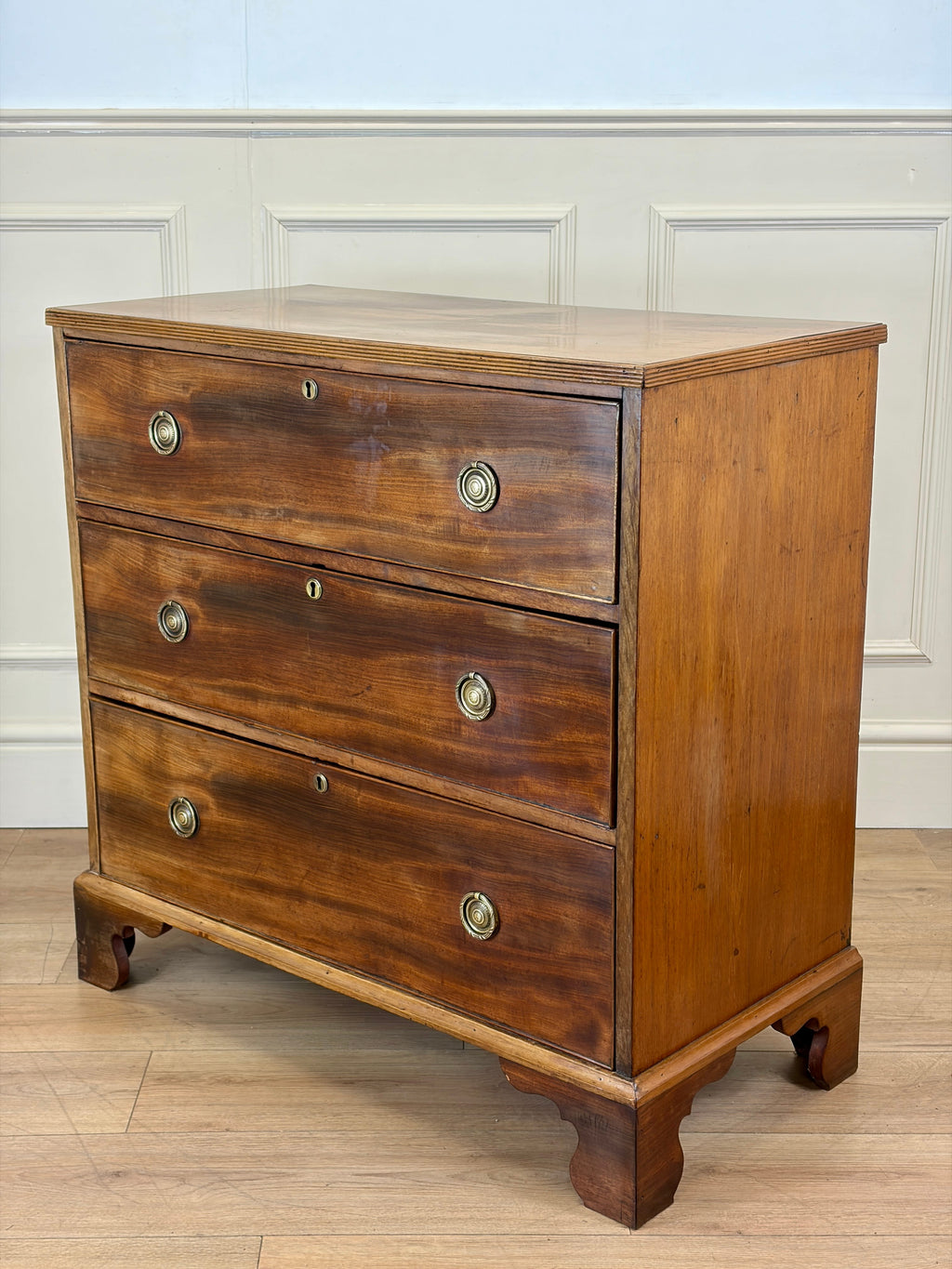 Antique small Georgian mahogany chest of drawers with three drawers and brass fittings