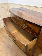 Wooden sideboard with two drawers on a wooden floor.