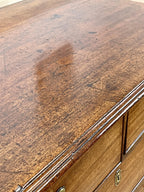 Close-up of a wooden surface with a large brown stain