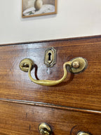 Wooden drawer with brass handles and keyhole