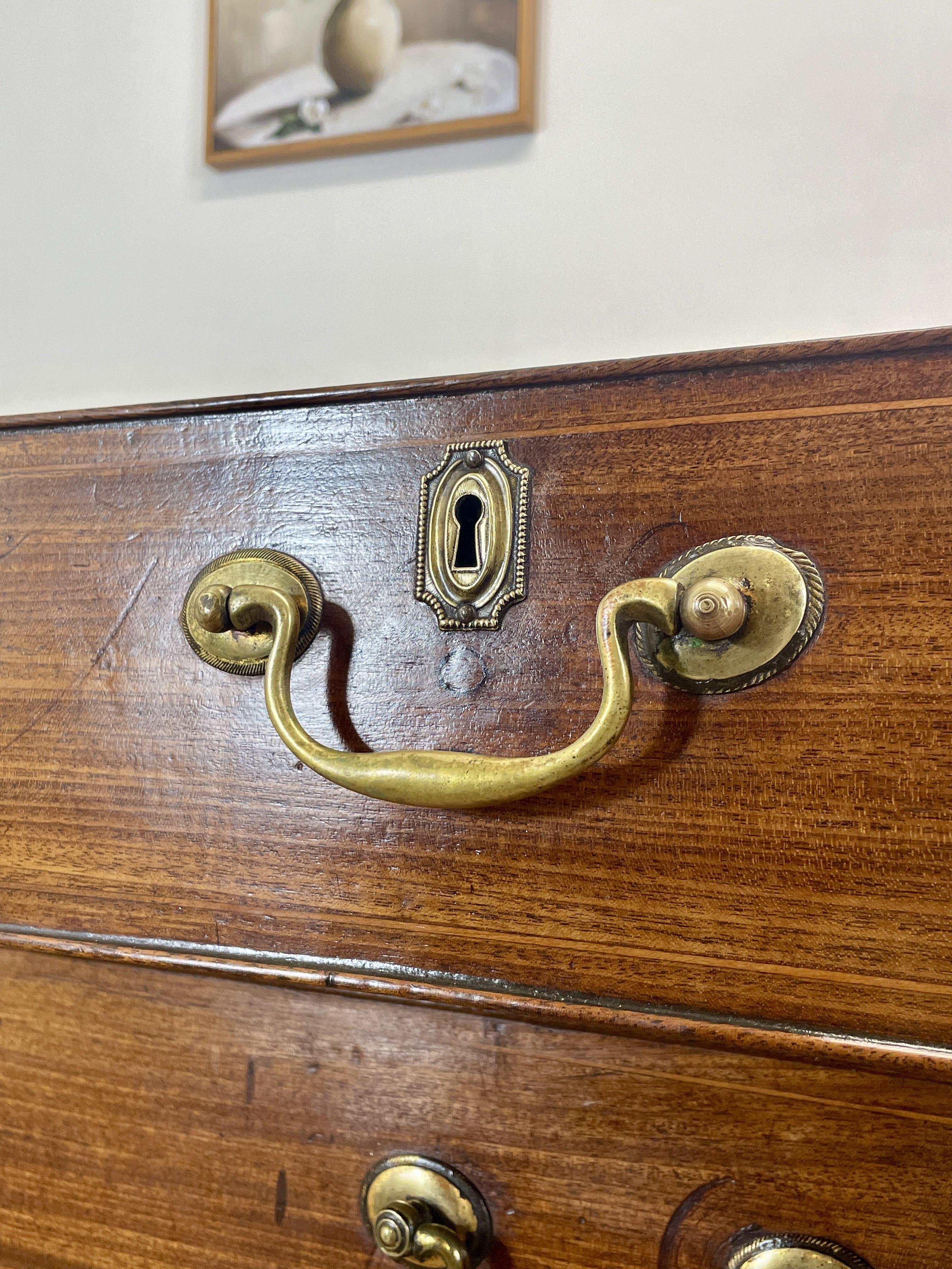 Wooden drawer with brass handles and keyhole