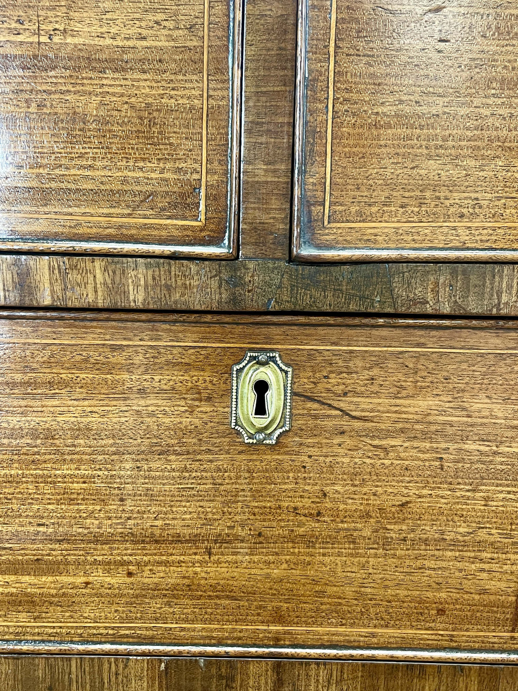 Close-up of a wooden cabinet with a keyhole
