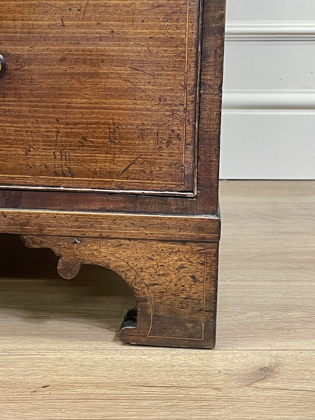 Wooden furniture leg on a light wooden floor