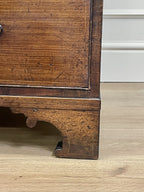 Wooden furniture leg on a light wooden floor