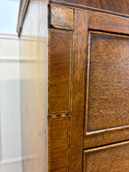 Close-up of a wooden cabinet with intricate detailing