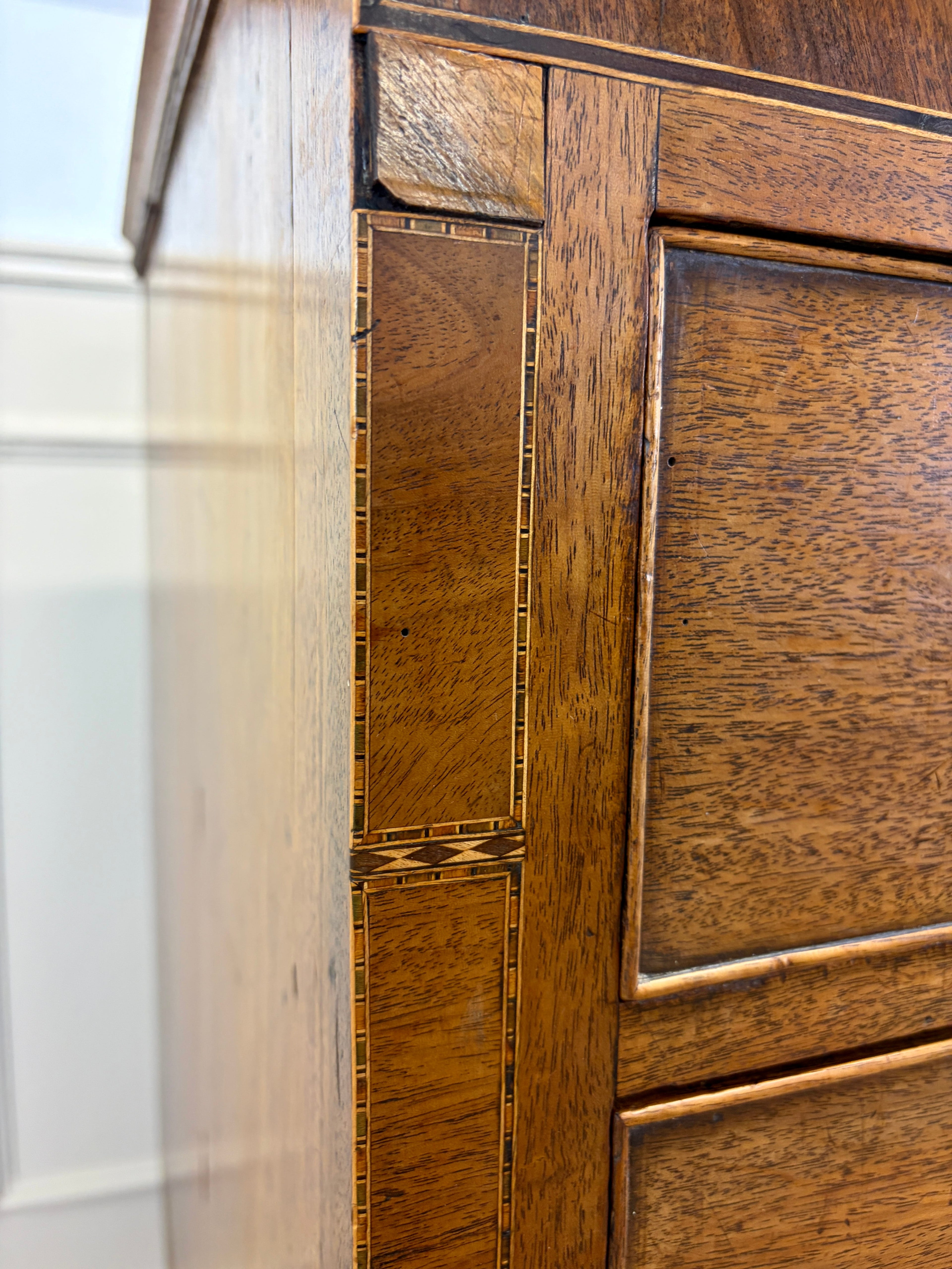 Close-up of a wooden cabinet with intricate detailing