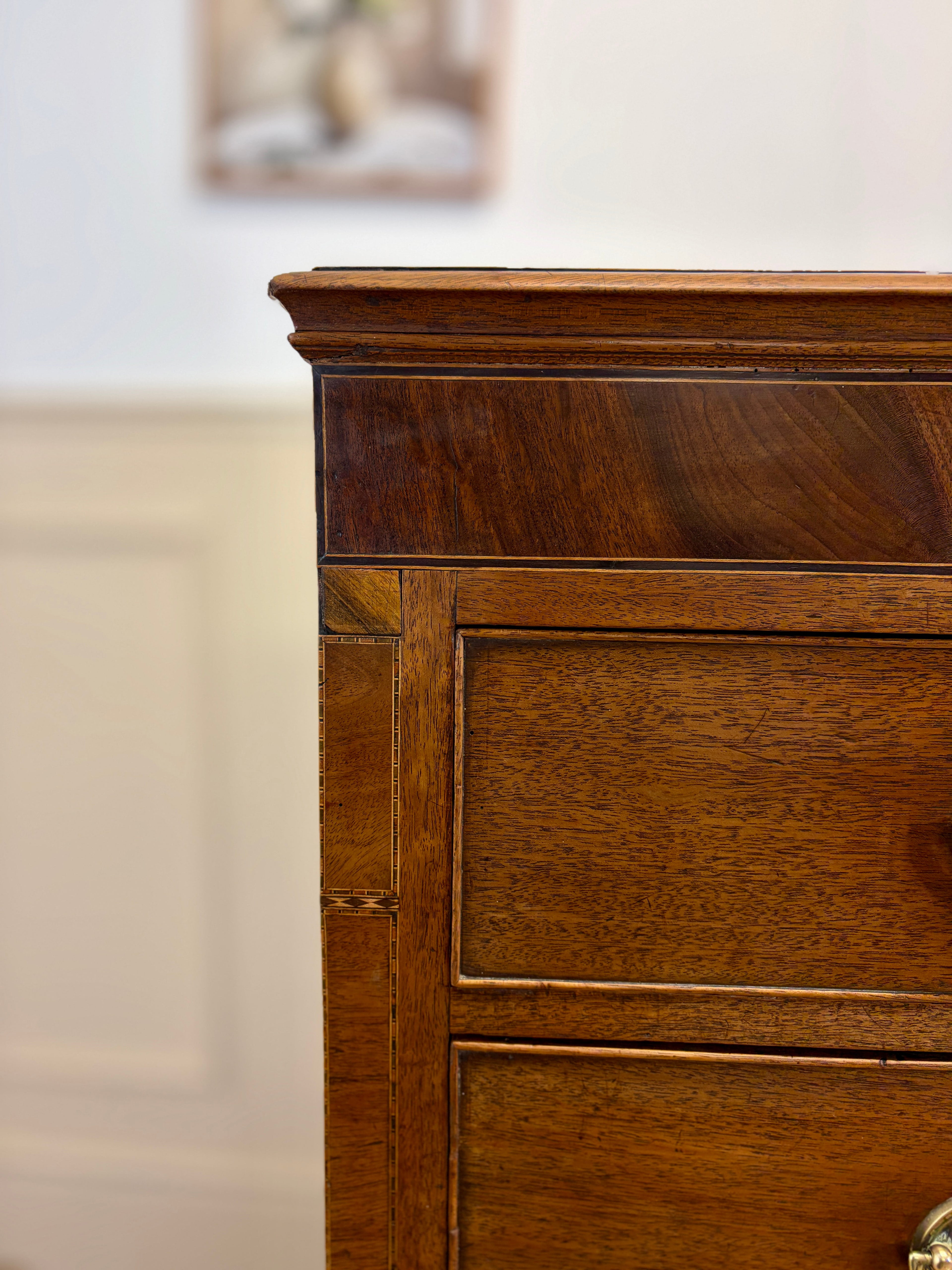 Close-up of a wooden dresser with a blurred background