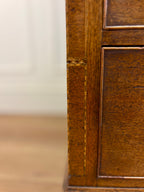 Close-up of a wooden cabinet with a blurred background