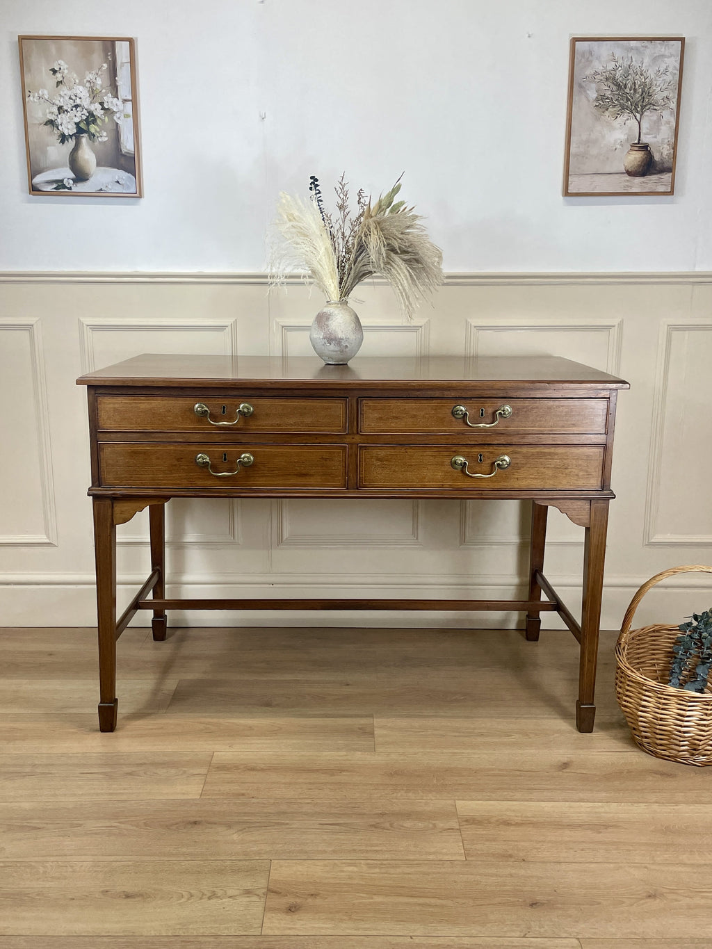 Wooden sideboard with decorative items on a wooden floor