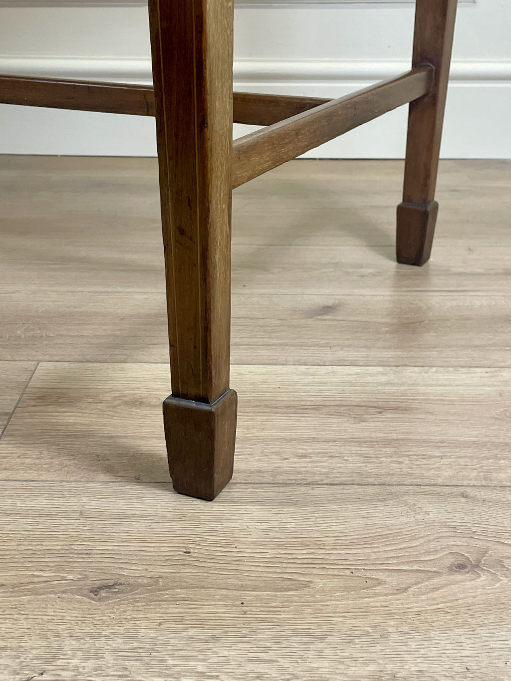 Wooden chair leg on a wooden floor