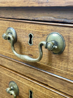 Wooden drawer with brass handles and keyholes