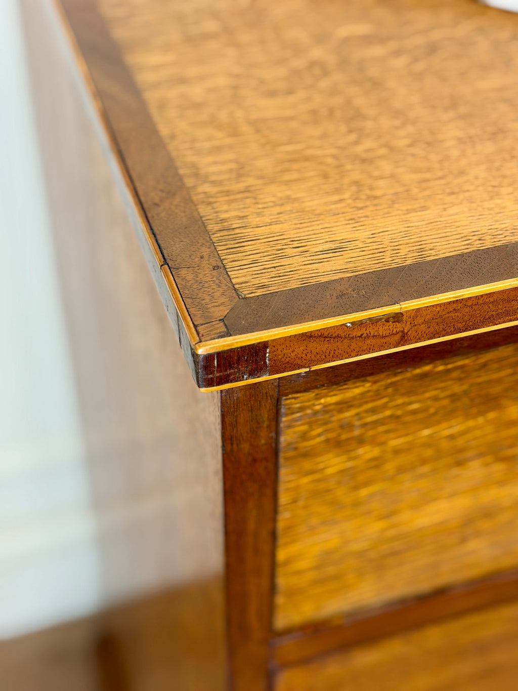 Close-up of a wooden side table with a white background