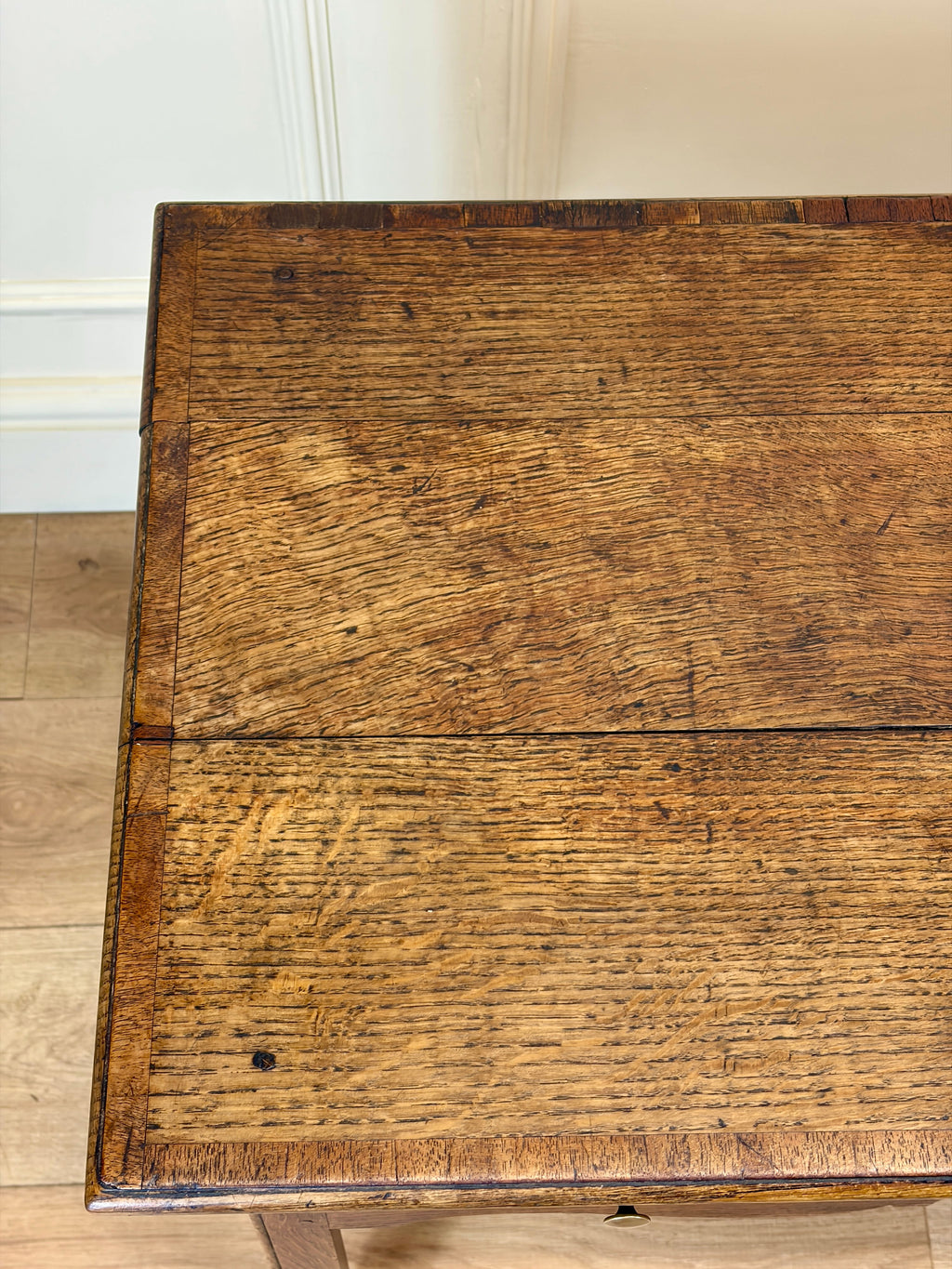 Close-up of a wooden surface with visible grain and wear