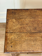 Close-up of a wooden surface with visible grain and wear