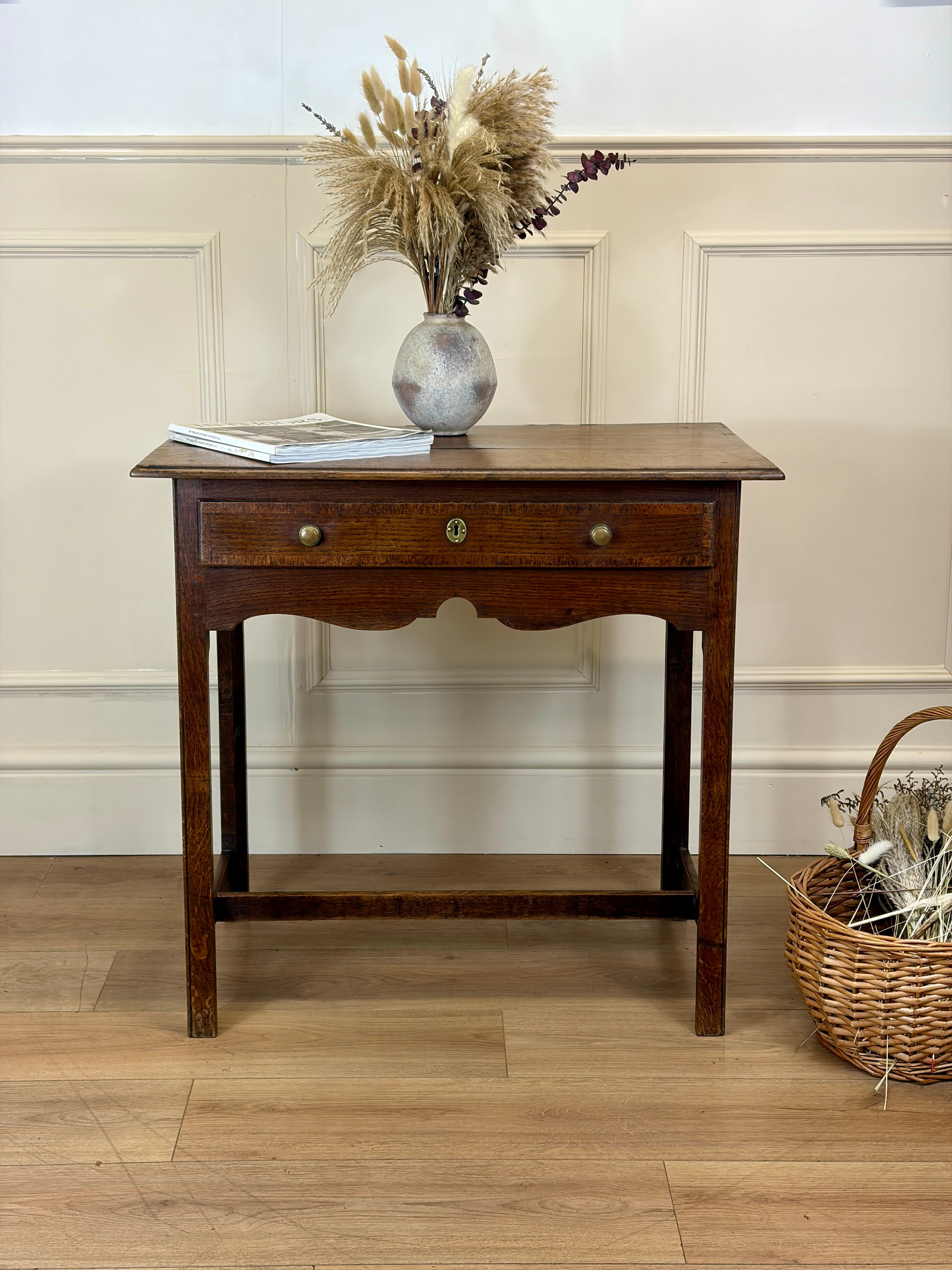 Antique Georgian light oak side table with frieze drawer shown from the front
