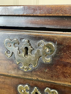 Antique Georgian mahogany bachelors chest of drawers with four long drawers on ogee bracket feet.