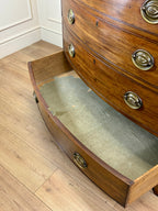 Wooden chest with glass front on a wooden floor