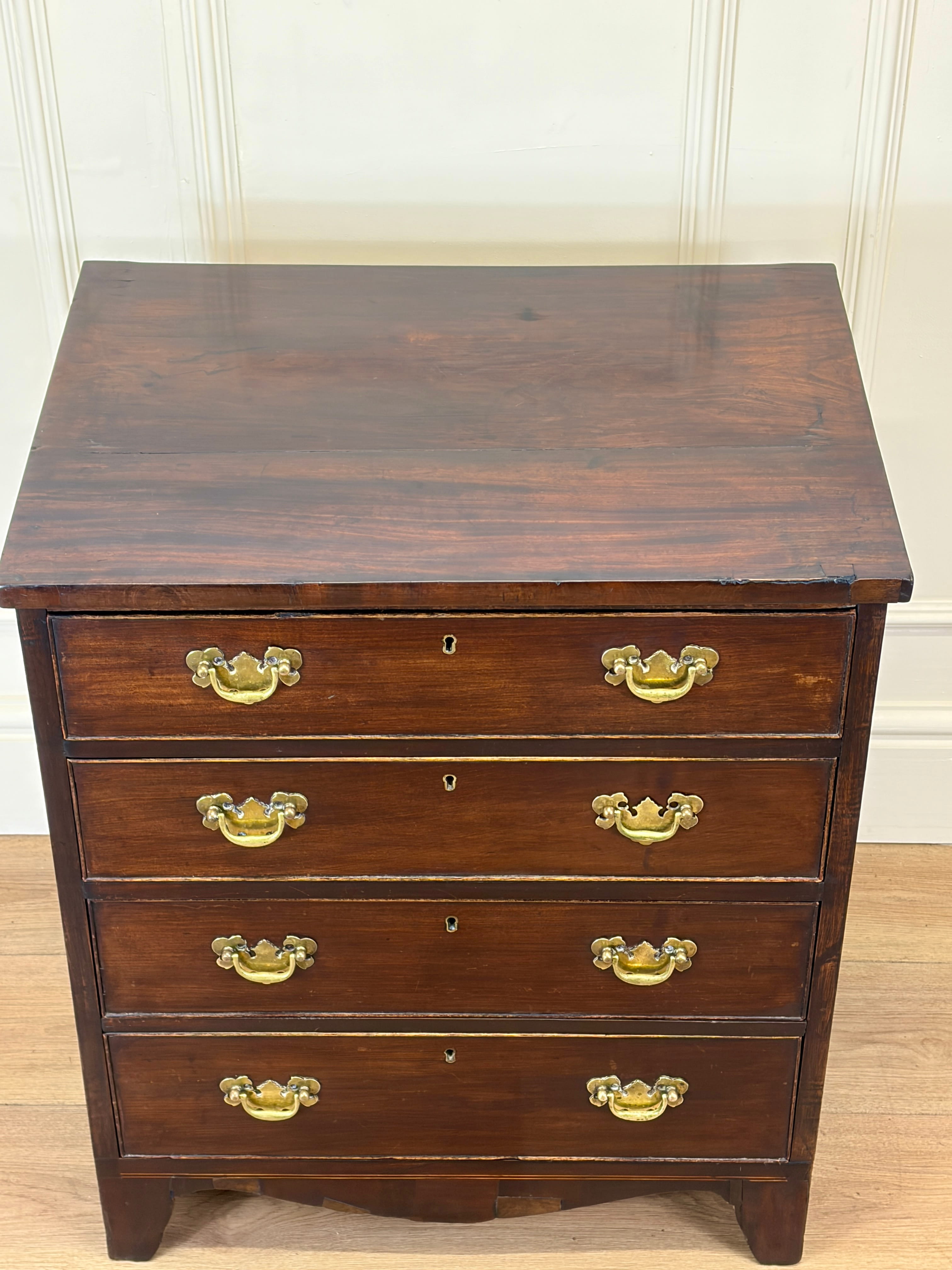 Antique Georgian mahogany small chest of drawers with four drawers and brass plated handles
