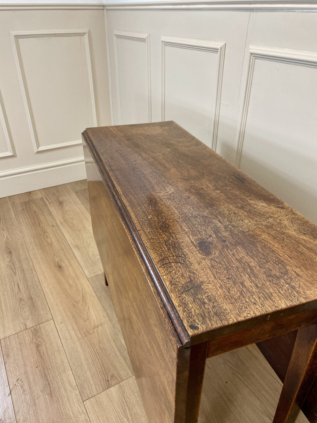 Antique Georgian Mahogany Square Kitchen Table with drop leaves, tapered legs, and rich mahogany finish, ideal for small cottage or farmhouse interiors.