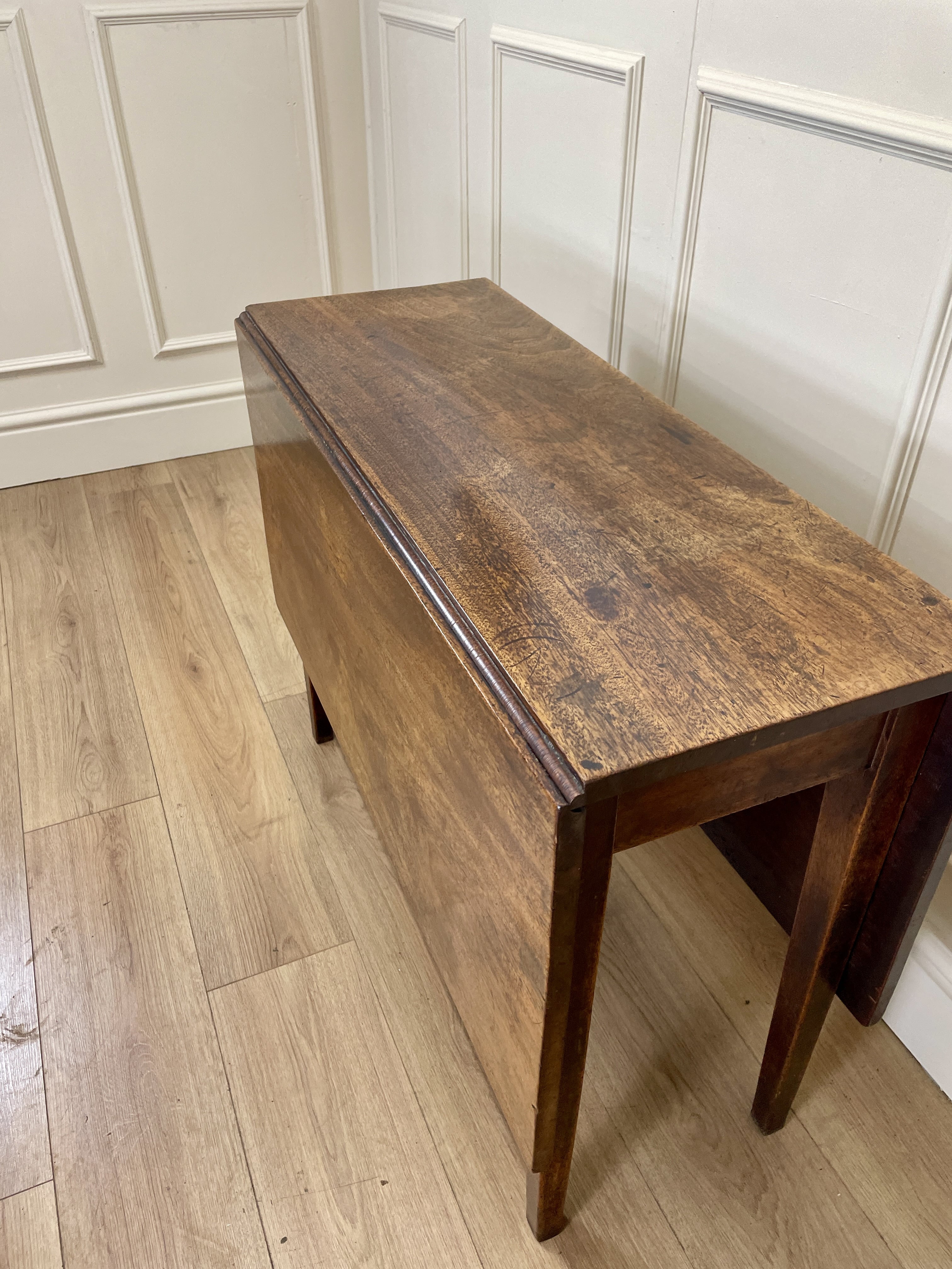 Antique Georgian Mahogany Square Kitchen Table with drop leaves, tapered legs, and rich mahogany finish, ideal for small cottage or farmhouse interiors.