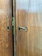 Antique Georgian mahogany tall slim wardrobe with drawers and oval panel doors on ogee bracket feet
