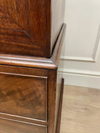 Antique Georgian mahogany tall slim wardrobe with drawers and oval panel doors on ogee bracket feet