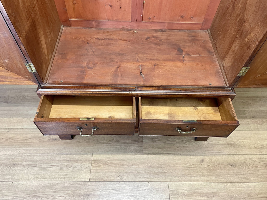 Antique Georgian mahogany tall slim wardrobe with drawers and oval panel doors on ogee bracket feet