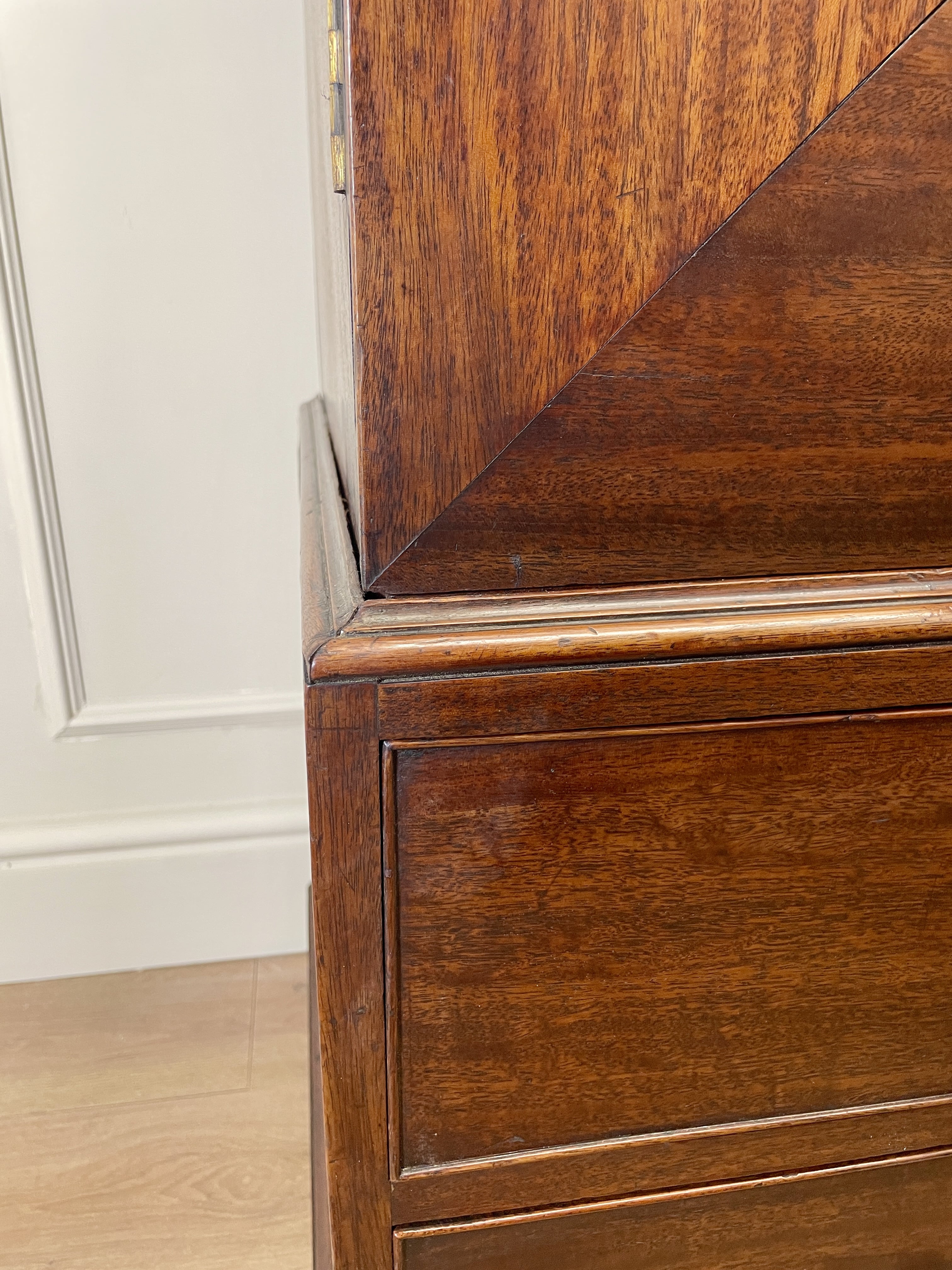 Antique Georgian mahogany tall slim wardrobe with drawers and oval panel doors on ogee bracket feet