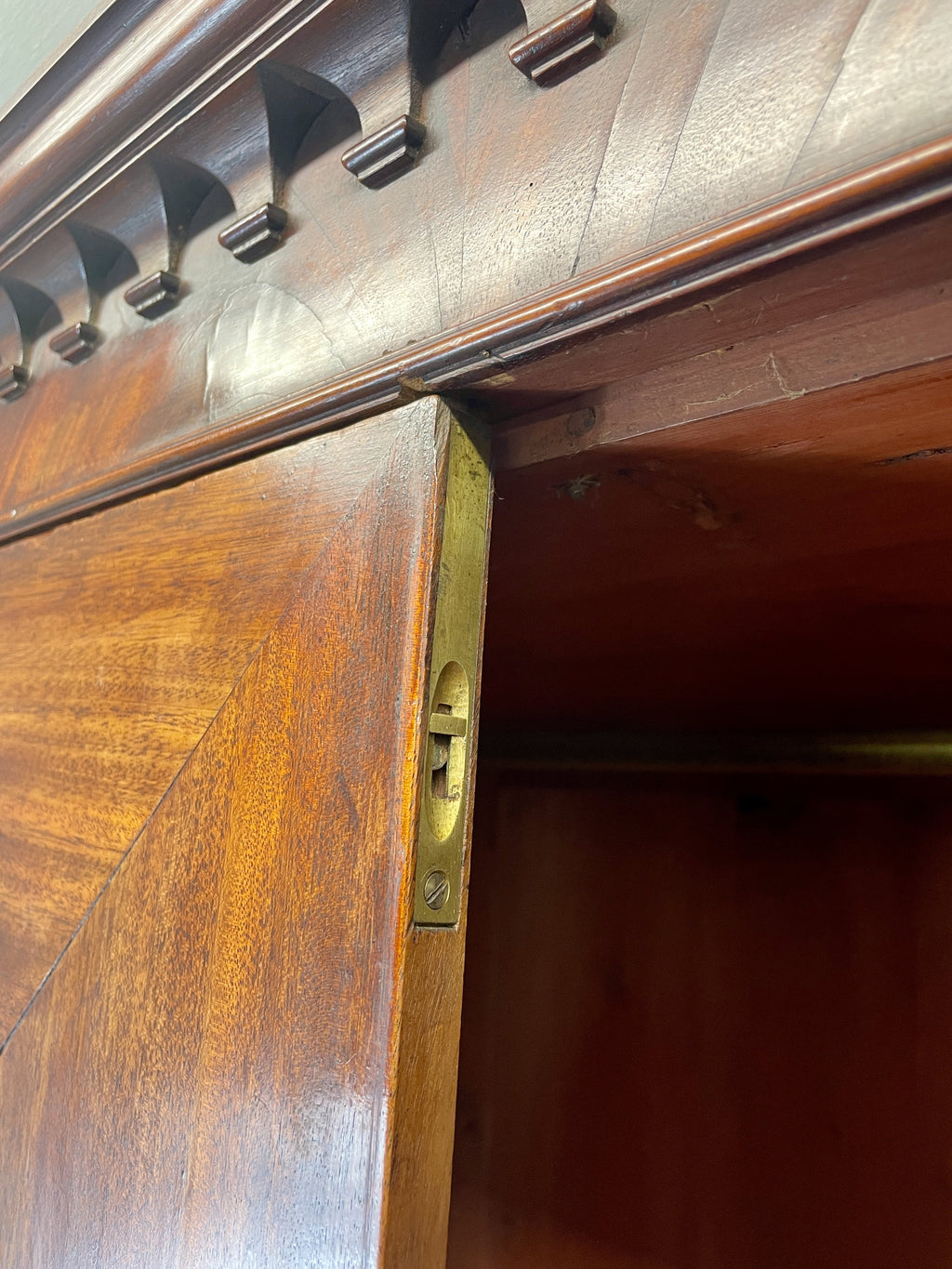 Antique Georgian mahogany tall slim wardrobe with drawers and oval panel doors on ogee bracket feet