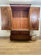 Antique Georgian mahogany tall slim wardrobe with drawers and oval panel doors on ogee bracket feet